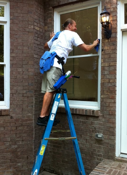 Window cleaning technician working in Smyrna, GA